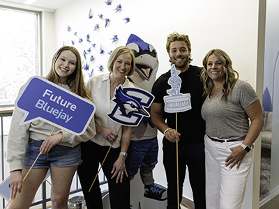 Students with Billy holding sign